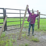 Mark Pastoor holds up the section of fence that someone cut, which allowed 52 of his bison to escape from the family bison ranch near Dalmeny, Sask. | William DeKay photo