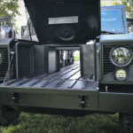 Bollinger Motors’ B1 and B2 models come with an eight-cubic foot trunk and a full length pass-through that enables operators to carry up to 16-foot boards with the tailgate closed. | Bollinger Motors photo