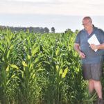 Adrian Moens of AJM Seeds discusses the agronomics of growing grain corn in southern Alberta during a Farming Smarter plot hop July 23 near Lethbridge. | Barb Glen photo