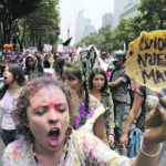 A demonstrator holds up a tortilla during a protest against glyphosate and genetic modification of crops in Mexico City in 2015. Public pressure on politicians to defy producer groups and scientic research has an effect on public policy in that country. | REUTERS/Ginnette Riquelme photo