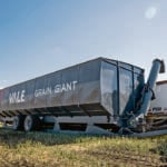 The Grain Giant is a 6500-bushel, temporary, in-field storage bin that has a bin that is 15 feet wide, 50 feet long and is just under 16 feet high when in transport mode. | Vale Industries photo