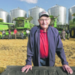 Lucien Fagnou stands with other members of the harvest crew before heading out to harvest a canola field. | William DeKay photo