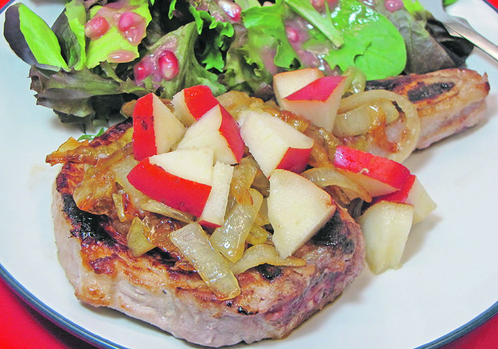 Pan-seared pork chops topped with juicy red pears and caramelized onions create a colourful and flavourful dinner.  |  Betty Ann Deobald photo