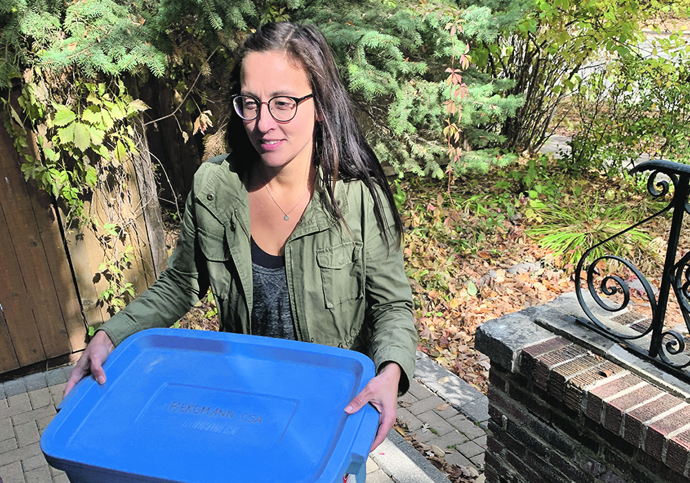 Jen Bergmann delivers a box of vegetables from her Winnipeg area farm.  | Ed White photo