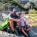 Dion, left, and Nathan Hrushkin at the Nodwell property where the dinosaur bones were found. | NCC photo