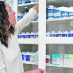 Wendy Davis checks the dispensary at her Harmony Health Clinic in Windthorst, Sask. | Christalee Froese photo