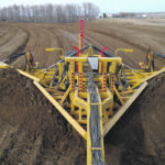 Swan River farmer Jeff Penner advocates wide shallow drains like this, which meander around the field so water soaks into the ground instead of flowing off the field. | Chris Laing photo