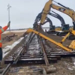 Carter Stewart, operations general manager for Weyburn Industrial Transload, said the required rail line has been built and after some test runs and ensuring the computer system works, the facility will open. | Screencap via Twitter/@Weyburnrail