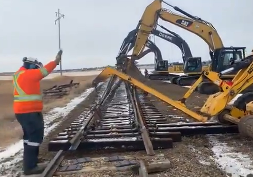 Carter Stewart, operations general manager for Weyburn Industrial Transload, said the required rail line has been built and after some test runs and ensuring the computer system works, the facility will open. | Screencap via Twitter/@Weyburnrail