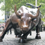 Huge government spending around the world is thought to also be behind the expected commodity bull market. The Wall St. Bull remains a symbol of aggressive financial market prosperity. | Reuters/Carlo Allegri photo
