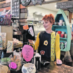 Jamie Aitchison rings up a customer at the Little Red Barn. The open space of the commercial kitchen just behind allows Aitchison and her staff to stay attuned to the needs of her customers while preparing food and beverages. | Maria Johnson photo