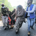 A supporter of the Aam Aadmi party is carried away during a nationwide strike against the newly passed agricultural reform law. | Reuters/Anushree Fadnavis photo