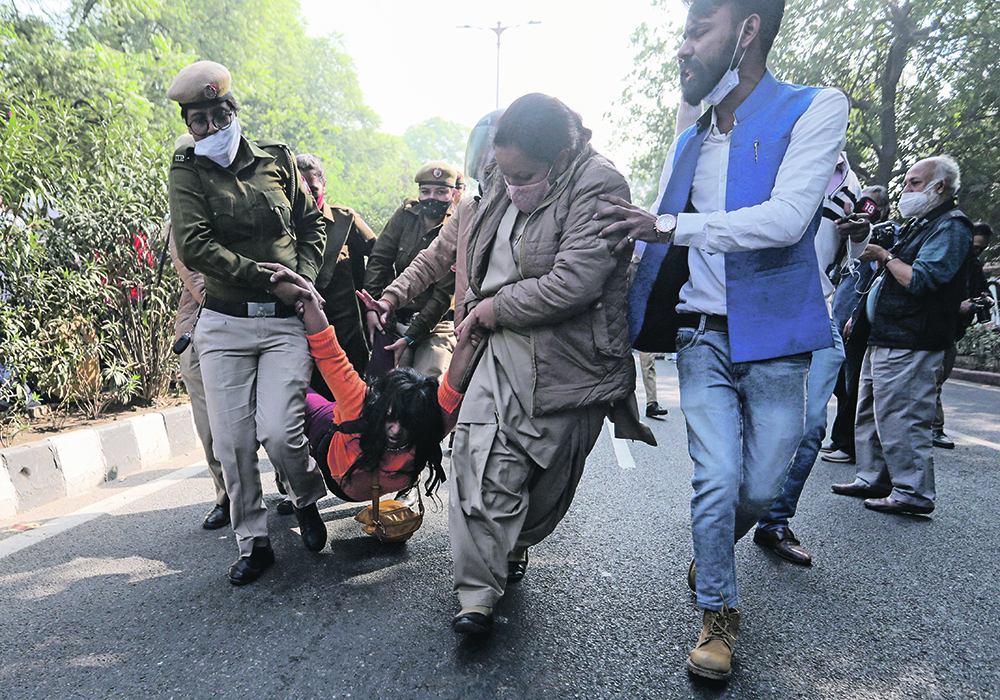 A supporter of the Aam Aadmi party is carried away during a nationwide strike against the newly passed agricultural reform law.  | Reuters/Anushree Fadnavis photo