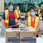 Enns Brothers in Manitoba partnered with McCain Foods for Free Fry Day, matching donations and raising $180,000 for STARS and Ronald McDonald House. Masked and gloved teams handed out French fries to the public and personally donated $10,000. | Enns Brothers photo