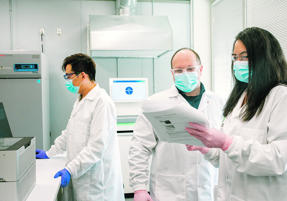 OPAL platform lead Peta-Gaye Burnett, right, works with research technicians Zhijian Chai and Rick Goertzen in the OPAL lab at the University of Saskatchewan’s Global Institute for Food Security.  | David Conlin photo