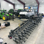 Built on a Harvest International toolbar, the Laser row units are on 15-inch centres for canola and beans, with second-row lockups for 30-inch corn and sunflower. Precision Planting Delta Force hydraulic down force manages them after Yetter units clear the way. Precision also looks after metering out three liquid products. Camso tracks keep it off the ground. | Travis Messer photo