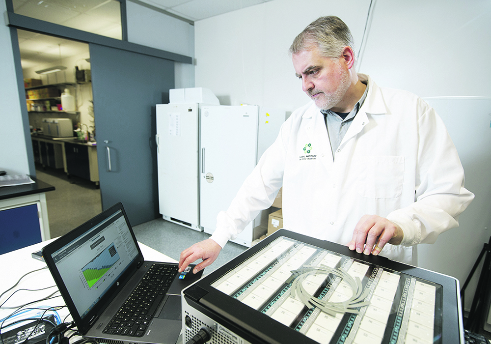 Andrew Sharpe works with the PromethION high throughput DNA and RNA sequencing device at the Global Institute for Food Security in Saskatoon.  | David Stobbe photo
