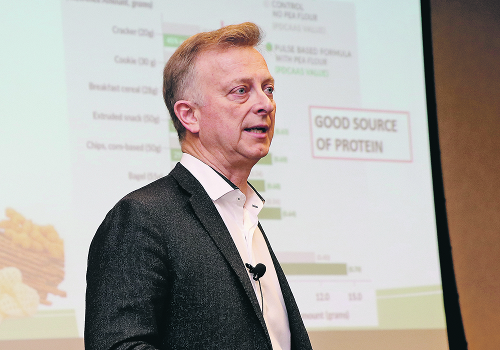 Gordon Bacon, seen here making a presentation at CropSphere in Saskatoon in 2019, has been chief executive officer of Pulse Canada since 1997.  | File photo