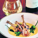 A rack of lamb is cut into chops and served with a fenugreek curry dipping sauce. This is a signature dish at Vij’s restaurant in Vancouver. | Sarah Galvin photo