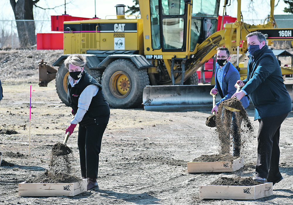 Lethbridge and District Exhibition board chair Bev Lanz, left, chief operating officer Mike Warkentin and Alberta premier Jason Kenney participate in the March 31 sod-turning ceremony for the $70.5 million Agri-food Hub and Trade Centre, scheduled for completion in about 20 months. | Barb Glen photo