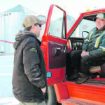 Blake Brownridge, left, talks to local farmer Lyle McLaren while McLaren picks up feed from Brownridge at Ridgeline Agriservices east of Arcola, Sask. | Christalee Froese photo