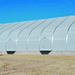 In war zones, ballistic missiles have reportedly bounced off the stretched high-tension fabric. Each panel from footing to peak is a high-strength 15 feet wide fabric that feels like steel. The Sprung buildings are rated as safe by hurricane officials in Dade county Florida. | Sprung photo