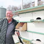 Bob Buskas has fledged thousands of purple martins on his farm with his specially designed purple martin houses. In his own North Star design, the compartments can be removed easily for cleaning and checking the young. Special entrance holes also deter owls, starlings and sparrows. | Mary MacArthur photo