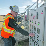 Jamie Bakos makes an adjustment at the pyrolysis facility near Craik, Sask. | Titan Clean Energy Solutions photo