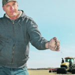 Gunter Jochum of St. Francois Xavier, Man., checks soil moisture in a field the family was seeding last weekend. The soil is dry where he worked the field last year to fix ruts. | Ed White photo