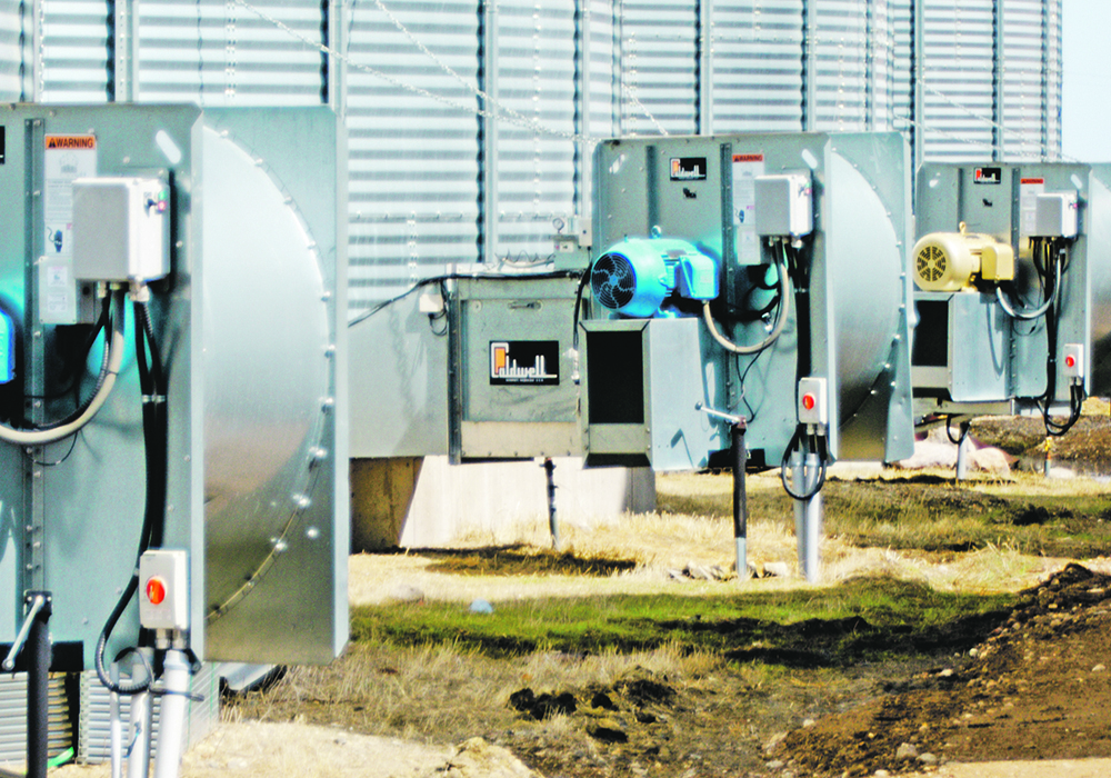 Aggressive early harvest means better grades and retained moisture that can later be used for blending low moisture grain. Careful management of fans and burners is more cost-effective than using a dryer, according to Dave Wall. | Wall Grain photo