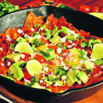 These chilaquiles may not be totally traditional, but they are tasty and easy to make. A cast iron skillet is your best friend when roughing it — perfect for breakfast. | Sarah Galvin photo