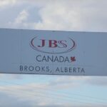 Workers at the JBS plant in Brooks, Alta. saw their shifts disrupted for two days following the late-May attack. | Screencap via Facebook/JBS Canada