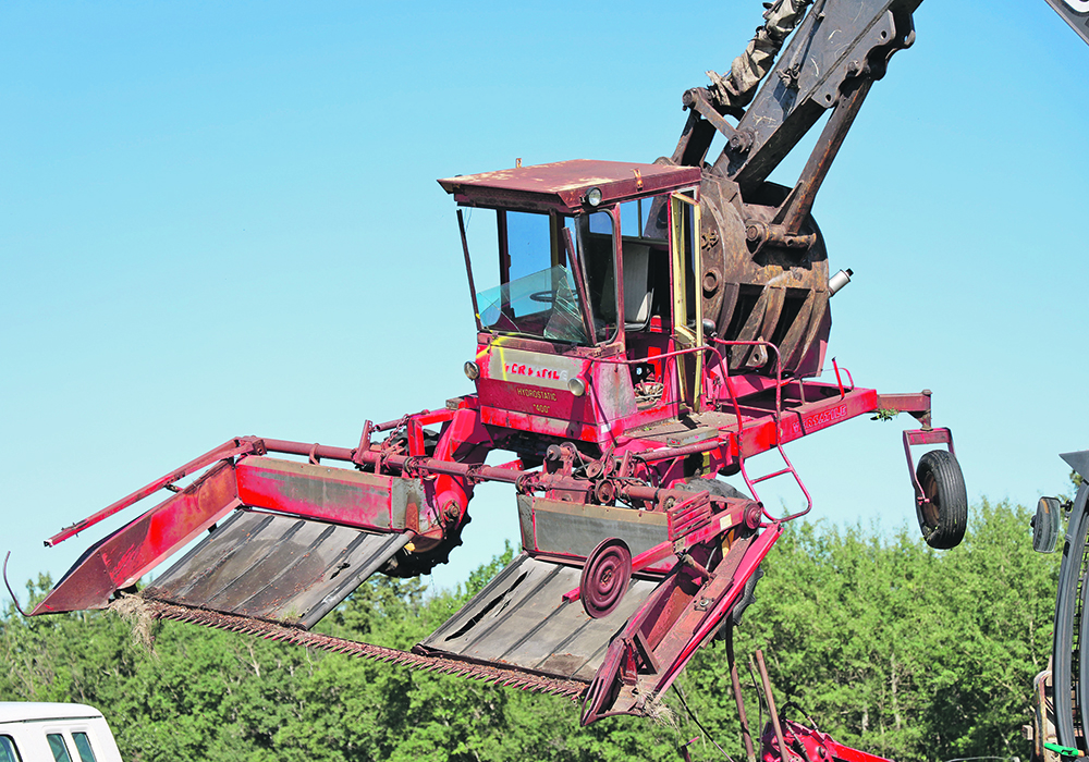 Duane Shelstad of Sylvan Lake, Alta., makes short work of a Versatile swather. | Mary MacArthur photo