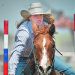 A determined Layton Chamberlain rides through the poles during the pole bending event. | Mike Sturk photo