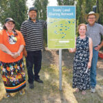 Mary Culbertson, treaty commissioner of Saskatchewan, left, helps install the first sign for the TreatyLand Sharing Network, along with Brad Desjarlais, Mary Smillie and Ian McCreary. | William DeKay photo