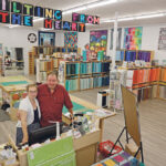 Ardelle and Roger Kerr turned a corner of their Quilting From the Heart store in Camrose, Alta., fabric store into a studio to teach classes online after COVID-19 changed the way businesses are run. The studio’s backdrop is a series of quilts that the couple made. | MARY MACARTHUR PHOTOS