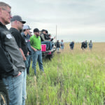 Participants at the recent Saskatchewan Forage Pasture Tour listen to Catherine Lang of the provincial agriculture department talk about new research into forage fertilizer. | Melissa Bezan photo
