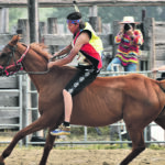Trent Ear rides around the rodeo arena to demonstrate the Stoney Nakoda Ghana Relay. | Mike Sturk photo