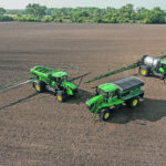 The John Deere 800R Floater is equipped with the same cab that’s used in the company's sprayers and 8R tractors. It also comes with a standard hydraulic pump that powers the New Leader dry-bins and Hagie liquid applicators, which makes switching between the units much easier. | John Deere photo.