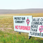 Signs posted along a road in Alberta’s Vulcan County near where the Travers Solar Project is being built demonstrate that not all rural residents are in favour of renewable energy project development in the province. | Alex McCuaig photo