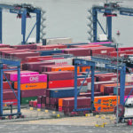 Shipping companies can make more money if they ship goods from Asia, unload them in North America and then immediately ship the empties back to Asia for quick turnaround rather than wait for them to be loaded with products such as identity preserved pulse crops. | Reuters/Andrew Kelly photo