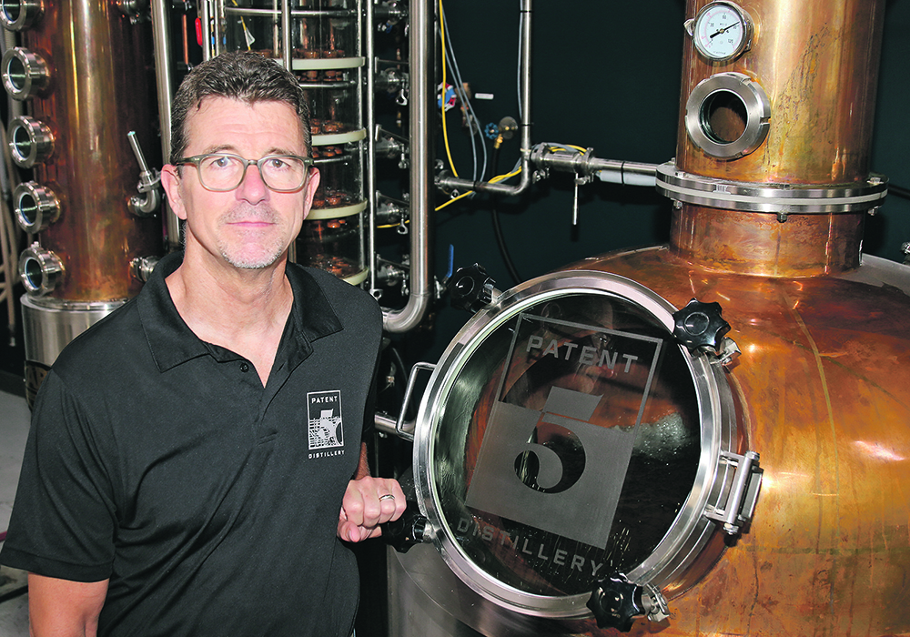 Brock Coutts, owner of the Patent 5 distillery, is part of a national campaign to push for alcohol tax rates that treat alcohol used for making spirits the same as alcohol used for making beer, at least for the small amounts used by micro-brewers and micro-distillers. | Ed White photo