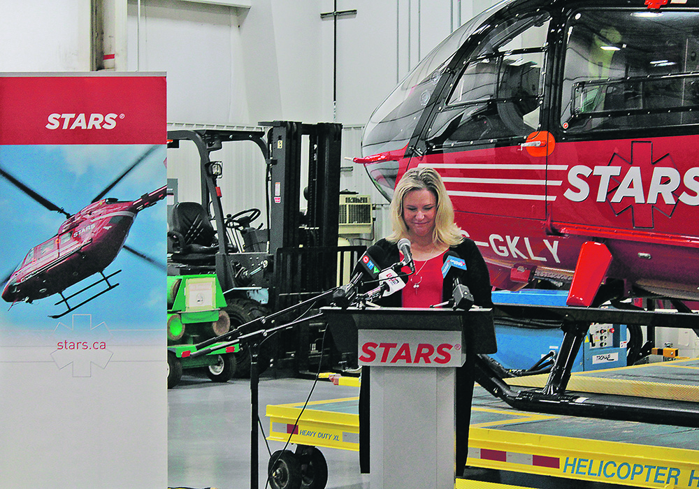 Tami Willson speaks during the recent launch of the new STARS fundraising calendar. She was transported to hospital by a STARS air ambulance four years ago after being thrown from her horse. | Melissa Bezan photo