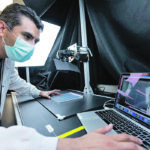 Postdoctoral Fellow Javier Mora Macias imaging plant samples by GIFS' photo bench. | GIFS photo