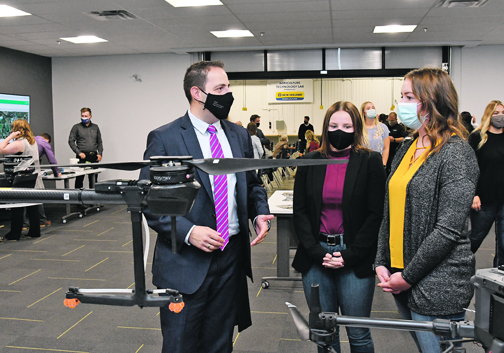 Minister of Advanced Education Demetrios Nicolaides learns about the latest drone technology in agriculture during the opening of the new degree program at Lakeland College. |  Lakeland College photo