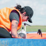 Leila Benmerrouche, a research associate with Saskatchewan Polytechnic, sets up the system prior to flight. | Maycie McWillie/SaskPolytechnic photo