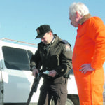 A Saskatchewan Wildlife officer checks a hunter's rifle during a routine stop. Beyond the usual rules, hunters are being asked to be aware of the fire risks they present this season. | File photo