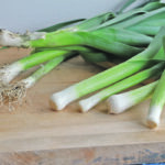 Fresh leeks look a lot like large green onions with flat rather than hollow leaves. Select those with a thick cylindrical, unmarked white stalk with tightly wrapped bright green leaves. Smaller ones are more tender. To prepare, cut off roots and discard, cut off the large dark green leaves, and add to soup stock for flavour. Keep the white end and pale green leaves for use in favourite recipes or freeze for later. | Betty Ann Deobald photo