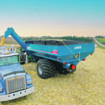 New features on the 1121 include improved cleanout, auger spout grain control, upgraded lighting, directional tip control, a low profile with short sides for operating on rolling terrain, optional Camso tracks, on-demand horizontal auger drive and dump door cleanout for quick crop changeover. | Kinze photo