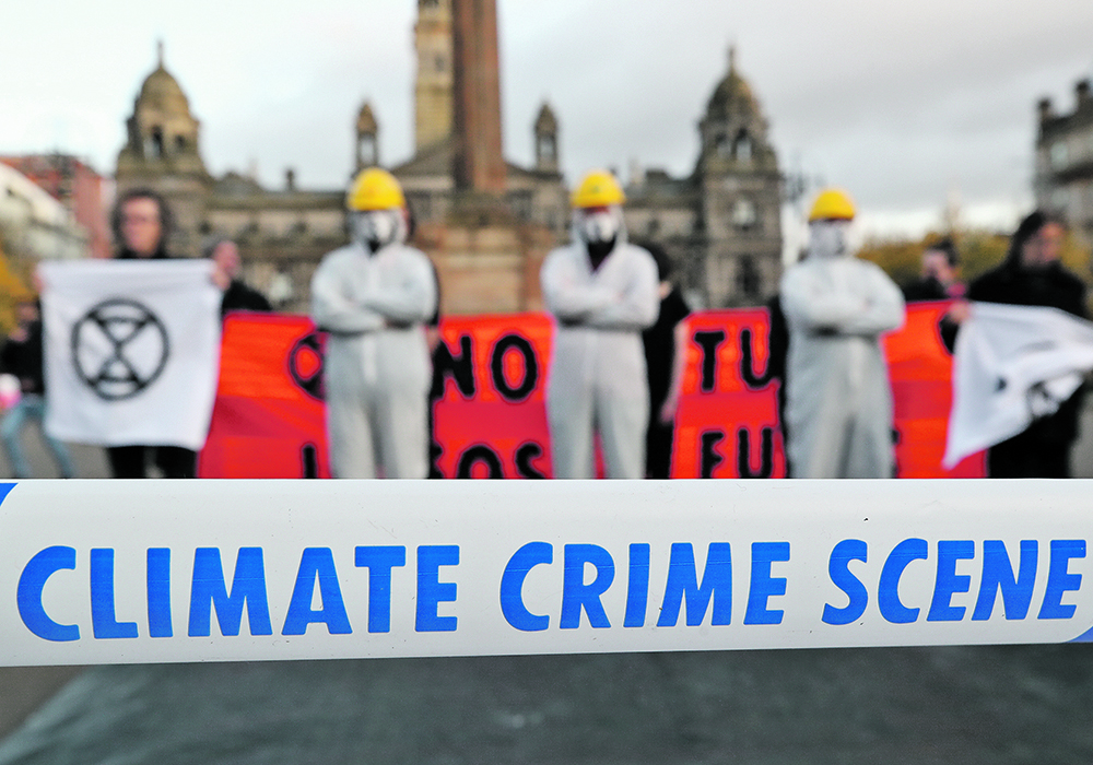 Protesters attend a demonstration against the fossil fuel industry during the UN Climate Change Conference in Glasgow, Scotland, last week.  |  Reuters/Yves Herman photo